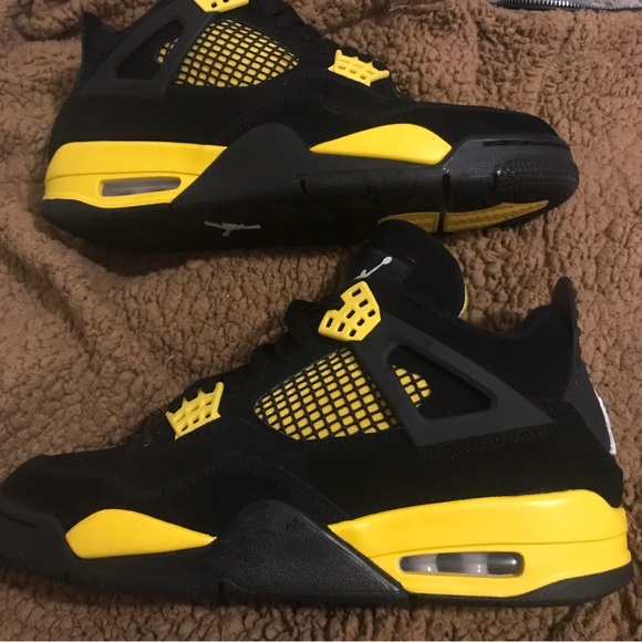 Yellow and black Jordan 4 yellow thunder